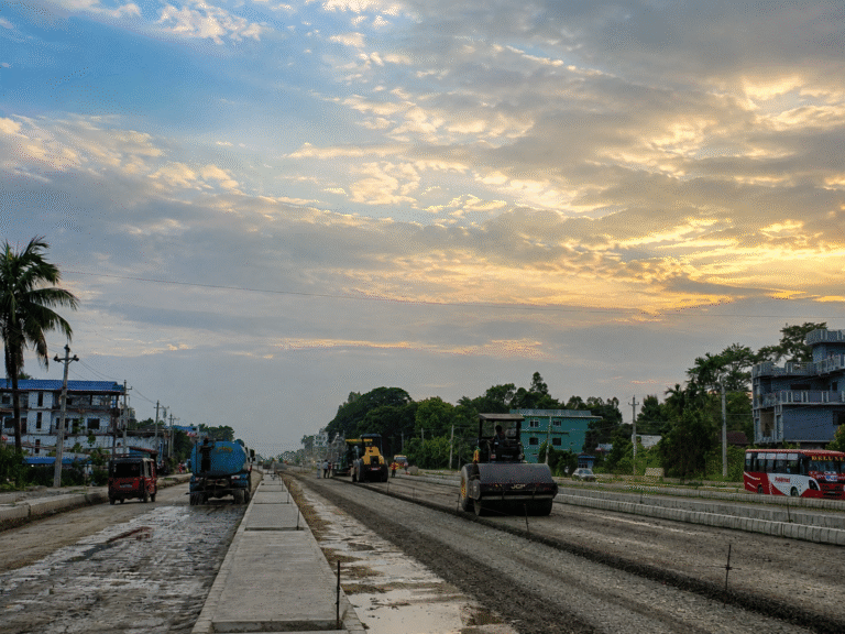 📸 PHOTO COMPETITION – CONTESTANT 20 👤 Name:  Dr. Chandika Lawoti  🏛️ Affiliation:  Consultant Community Physician, Ministry of Health Koshi  Caption:  This was captured at Biratchowk, Morang, Nepal’s Mahendra Highway (East–West Highway), this photograph portrays the complex relationship between development and health. The ongoing highway construction represents progress and improved connectivity, while exposed soil, dust and construction activities create environmental health hazards for nearby communities and road users. The water tanker spraying the road reflects a simple but important local effort to reduce dust and its exposure. The image therefore captures both sides of development,its benefits and its unintended health risks,while highlighting community-level action and resilience in creating a healthier environment.